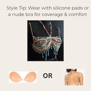 May include: A beaded top with a variety of colorful stones and gold chain straps. The top is displayed on a black mannequin. The image also includes two options for coverage: silicone pads or a nude bra.