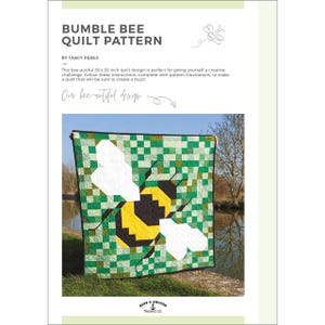 May include: A handmade quilt featuring a large bumble bee design. The bee is yellow and black, with white wings, set against a green and white checkered background. The quilt measures 55 x 55 inches.