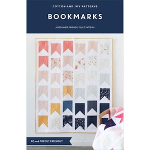 May include: A quilt pattern titled "Bookmarks" by Cotton and Joy Patterns. The quilt features a repeating flag design in various colors, including coral, pink, yellow, navy, and white. The text "A Beginner Friendly Quilt Pattern" is also visible.