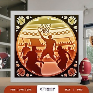 May include: A digital file for a laser cut design of a basketball player in a stadium with a basketball hoop and basketballs. The design is in a circular frame with a yellow, orange, and red color scheme.