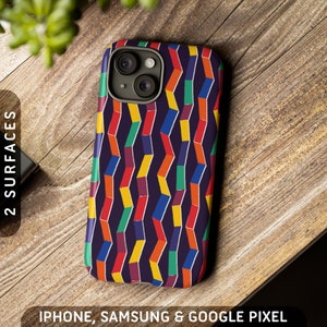 May include: A colourful phone case with a geometric pattern of overlapping rectangles in shades of red, yellow, green, blue, and purple on a dark blue background. The case has a raised camera bump with two lenses.