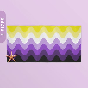 May include: A beach towel with a wavy pattern in yellow, white, purple, and black colors. The towel is a representation of the non-binary pride flag.