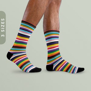 May include: A pair of colourful striped socks with a rainbow pattern. The socks are made of a soft, comfortable material and are perfect for everyday wear.