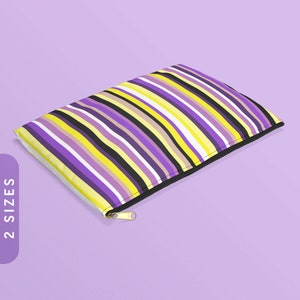 May include: A purple, yellow, and black striped zippered pouch. The pouch is made of fabric and has a gold zipper.