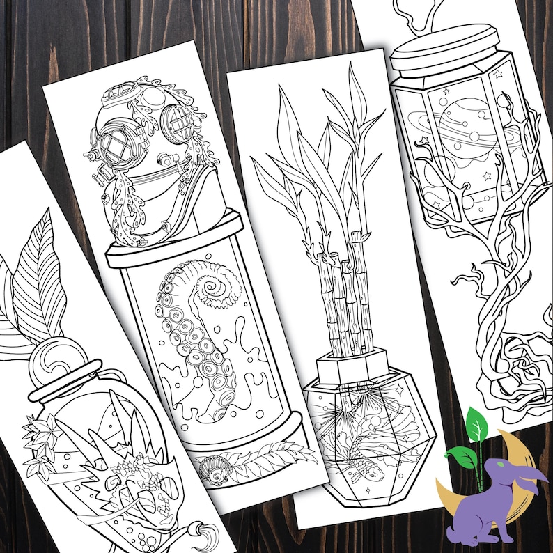 May include: A collection of black and white illustrated bookmarks. Each bookmark features a unique design, including a diver's helmet, an octopus tentacle, bamboo stalks, and a jar with planets. The bookmarks are on a dark wood surface.