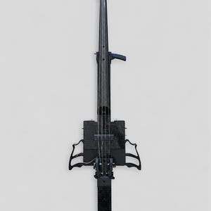 May include: An electric violin with a black carbon fibre finish, featuring a long neck, a rectangular body, and two curved side supports. The instrument includes silver tuning pegs, a bridge, and thin strings extending along the length of the neck.