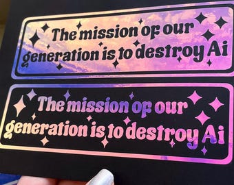 May include: Two rectangular stickers on a black card, featuring holographic text that reads "The mission of our generation is to destroy Ai" surrounded by small star icons. The stickers have a reflective, iridescent finish that shifts colors.