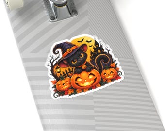 May include: A sticker featuring a black cat wearing a purple witch hat, perched on a glowing orange jack-o'-lantern. The scene includes autumn leaves, a dark silhouette of a haunted house, bats, and a full moon, all applied to a grey skateboard.