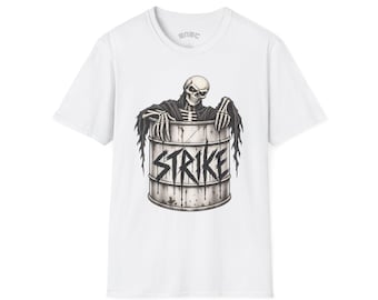 May include: A white short-sleeved t-shirt featuring a graphic of a skeleton in a dark hooded robe emerging from a metal barrel. The word STRIKE is printed in a bold, distressed black font across the front of the barrel, which has dark drips.