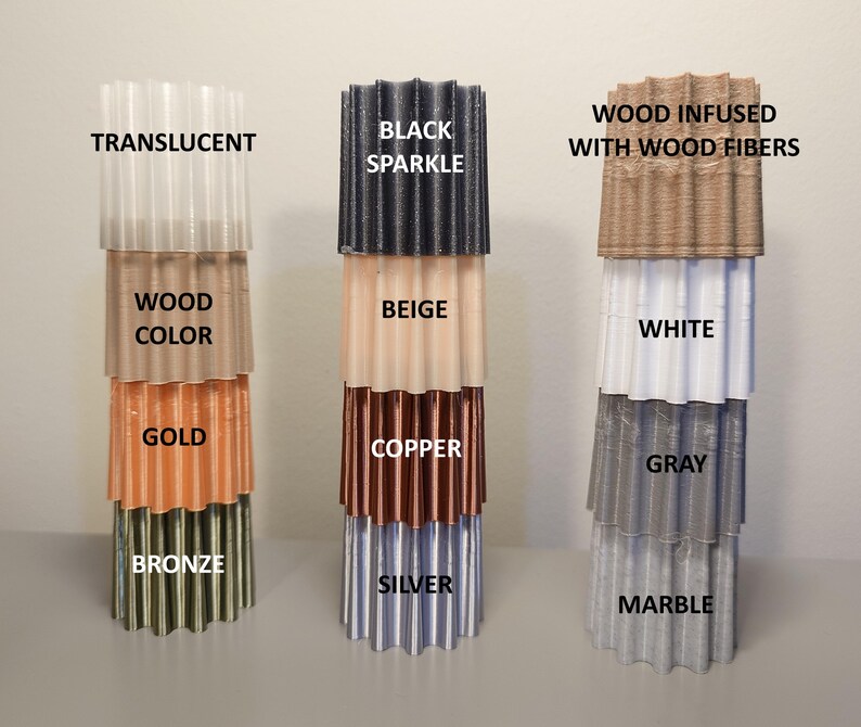 May include: A set of six stacked, corrugated plastic tubes in various colors, including translucent, black sparkle, beige, wood color, gold, copper, white, gray, bronze, silver, and marble. The tubes are labeled with their corresponding colors.
