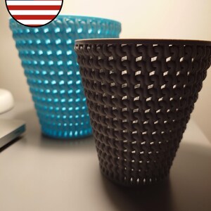 May include: Two woven plastic baskets, one blue and one gray, on a white surface.