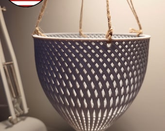 May include: A gray hanging planter made of a lattice design with a rope hanger.