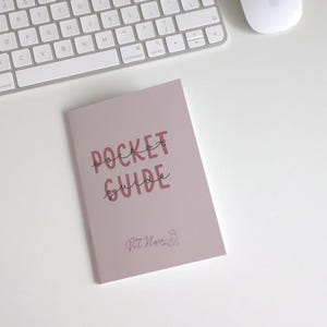 May include: A mauve-coloured pocket guide booklet with the text POCKET GUIDE printed in bold pink letters and a smaller logo featuring the text Vet Nurse Life with a line-art dog icon positioned below the main title on the front cover.