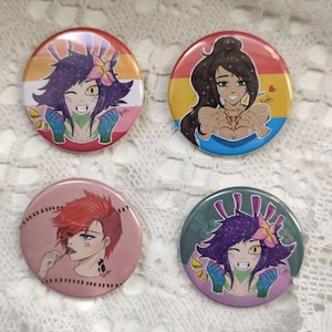 May include: Four round buttons featuring different cartoon characters. Each button is approximately 5 cm in diameter and has a white background. The first button depicts a purple-haired character with green skin and a flower in their hair. The second button shows a brown-haired character wearing a blue dress and holding a heart in their hands. The third button features a red-haired character with a lollipop in their mouth. The fourth button showcases a purple-haired character with green skin and a flower in their hair.