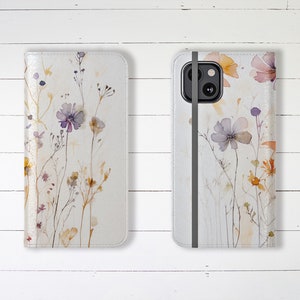 Estuche tipo billetera para teléfono con hermosas flores silvestres en tonos pastel, ranuras para tarjetas de crédito y soporte, estuche tipo billetera único y elegante de diseñador para iPhone y Samsung Galaxy.