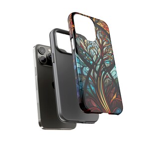 May include: A black phone case with a colorful stained glass design. The case features a pattern of blue, green, yellow, red, and orange.