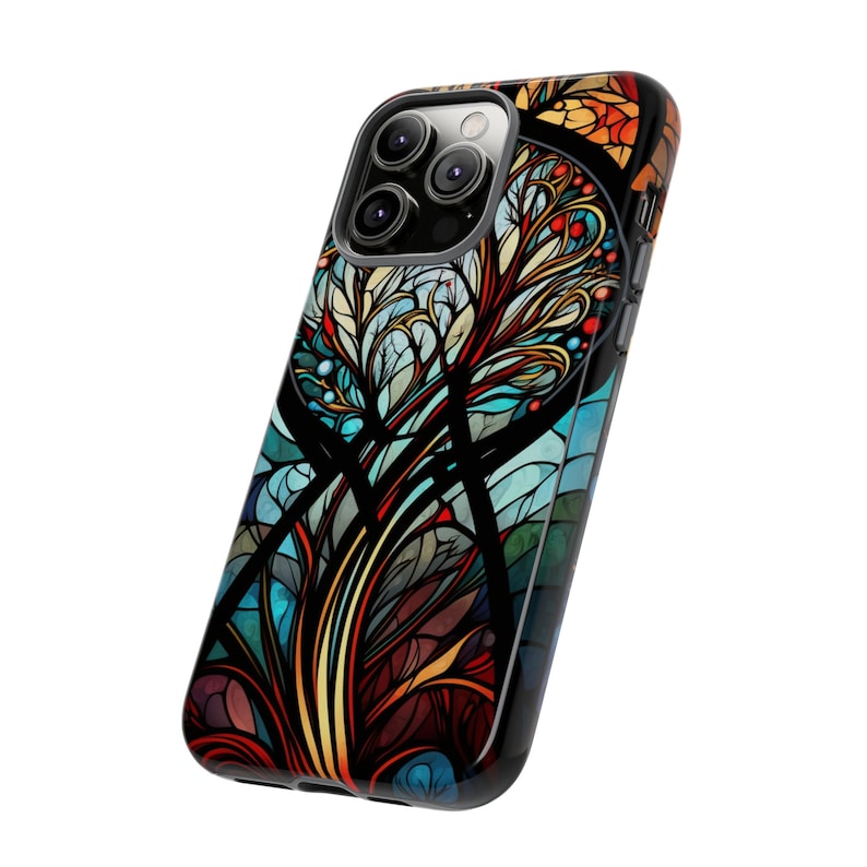 May include: A black phone case with a colorful stained glass design featuring a tree with blue, red, orange, and yellow accents.