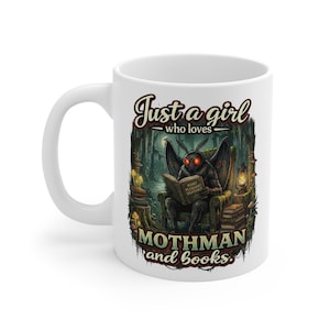 May include: White ceramic mug featuring a colorful illustration of a Mothman reading a book in a forest setting. The mug has the text "Just a girl who loves Mothman and books."