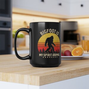 Embrace the Mystery with &#39;Bigfoot is My Spirit Animal&#39; Mug - Ideal Gift for Adventurers & Cryptid Enthusiasts. Black Mug, 15oz
