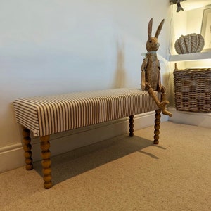 Upholstered bench, hallway or end of bed bench in ticking  fabric with Bobbin legs