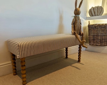 Upholstered bench, hallway or end of bed bench in ticking  fabric with Bobbin legs