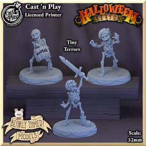 May include: Three 32mm scale miniature skeletons in various poses. One skeleton holds a pumpkin, another holds a sword, and the third is in a playful pose. The miniatures are painted in a light grey colour and are set on a light blue base. The image includes the text "Cast 'n Play Licensed Printer" and "Tiny Terrors".