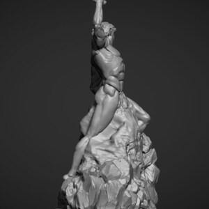 Opposing side view of the statue. A render of the statue. The man is in an action pose, heaving his hammer skyward to crash onto the chisel he is using to sculpt himself from the rock.