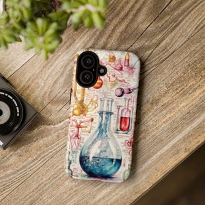 May include: A smartphone case featuring a colorful scientific illustration with beakers, flasks, and other lab equipment. The design includes a large blue flask with liquid, and other lab tools in red, yellow, and pink.
