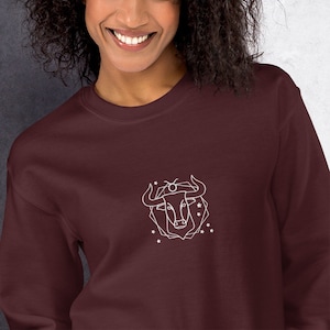 Taurus unisex embroidered sweatshirt. Taurus zodiac sign sweatshirt. Comfortable astrology sweatshirt with bull and stars. Taurus Horoscope