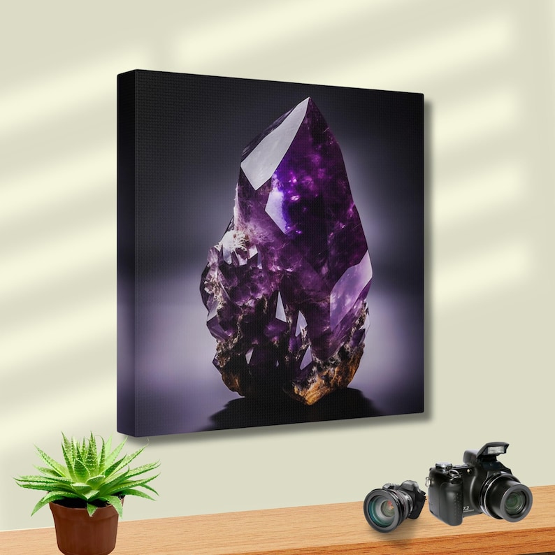 May include: A canvas print of a striking purple amethyst crystal. The crystal is sharply pointed with multiple facets, set against a dark backdrop. The base of the crystal has a rough, textured appearance. The image is well-lit, highlighting the crystal's details.