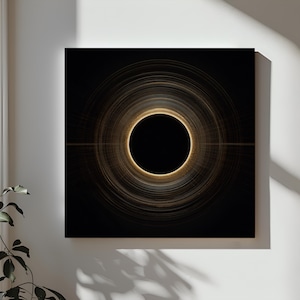 May include: Abstract art print featuring a central black circle surrounded by concentric golden rings against a black background. The artwork has a modern, minimalist aesthetic, suitable for home or office decor.