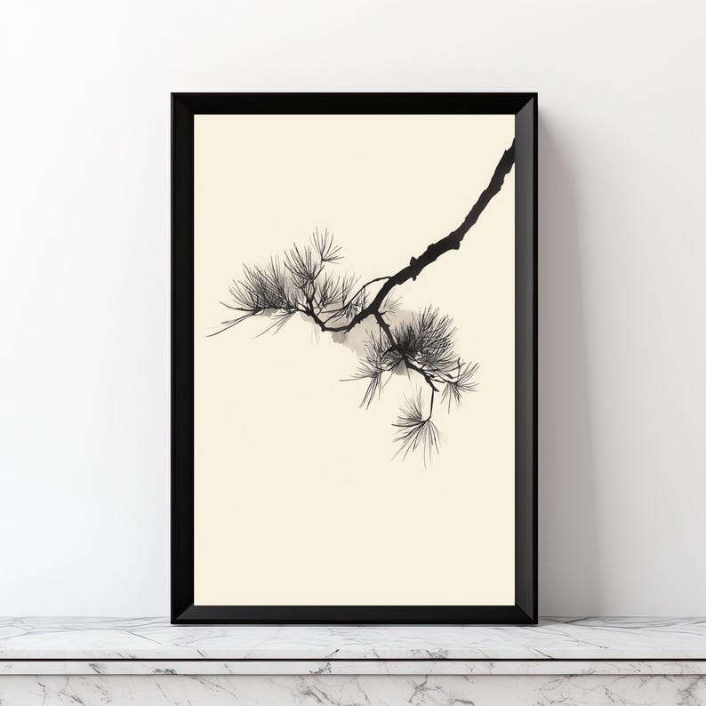 May include: A framed wall art print featuring a black ink illustration of a pine tree branch with needle clusters. The artwork is set against a solid cream-colored background and enclosed within a thin, black rectangular frame.