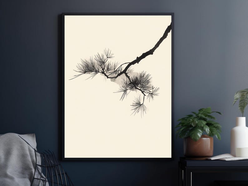 May include: A framed wall art print featuring a black ink illustration of a pine tree branch with needle clusters on a solid cream-colored background. The artwork is enclosed in a thin black frame, showcasing a high-contrast botanical design.