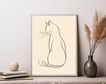 May include: A framed wall art print featuring a black line drawing of a cat in profile against a solid light beige background. The cat is depicted in a simple, continuous outline style, showing the head, ears, whiskers, back, and curled tail.