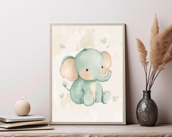May include: A framed wall art print featuring a watercolor illustration of a seated baby elephant with light green skin, soft pink ears, and rosy cheeks, set against a pale cream background decorated with small, faint green heart shapes.