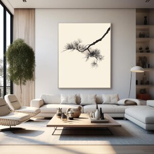 May include: A large rectangular wall art piece featuring a black ink illustration of a pine tree branch with needles against a solid cream-colored background, framed in a thin light-colored wooden frame and mounted on a white wall.