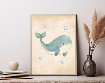 May include: A framed wall art print featuring a light blue whale illustration centered on a textured beige background. The whale has a cream-colored underbelly and is surrounded by several small, light blue circular bubbles floating around it.