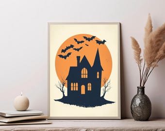May include: A rectangular wall art print featuring a dark blue silhouette of a multi-story house with a pointed roof and arched windows. Behind the house is a large orange circular moon with a flock of dark blue bats flying across the sky.