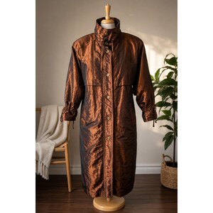 Vintage Jerish trenchcoat uit de jaren 80 in iriserend brons, metallic, lange kleur, maat 10.