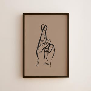 Fingers Crossed Art Print - Good luck vibes. Black ink on soft brown.