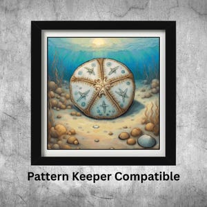 May include: A framed watercolor print of a sand dollar on a sandy ocean floor. The sand dollar is beige with blue starfish designs. The background features blue water, sunlight, and seaweed. The text "Pattern Keeper Compatible" is at the bottom.