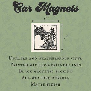 May include: Square car magnet, 5 inches by 5 inches, featuring a black and white dragon illustration breathing fire onto stone cubes. The text "Car Magnets" is at the top. The magnet is durable, weatherproof, and has a matte finish.