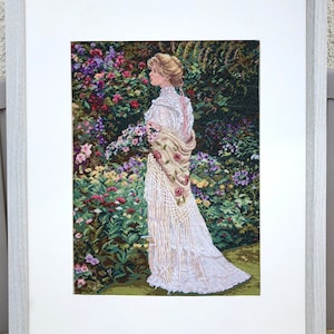 In Her Garden, by Dimensions Gold Collection , completed 18 ct cross stitch artwork, 11x16 in (28x41 cm), frame size 16x20 in (40.6x50.8cm)