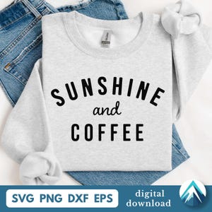 May include: A light gray sweatshirt with the words "SUNSHINE and COFFEE" in black block letters. The sweatshirt is folded on top of blue denim jeans. The image also includes the text "SVG PNG DXF EPS" and "digital download".
