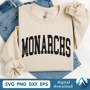 May include: A cream-coloured sweatshirt featuring the word "MONARCHS" in bold, black, arched lettering. The sweatshirt is folded on top of blue denim jeans. The image includes the text "SVG PNG DXF EPS" and "digital download".