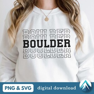 May include: White sweatshirt with the word "BOULDER" repeated in a stacked, retro design. The word "BOULDER" is in bold black font, with the rest of the text in a thin black outline.