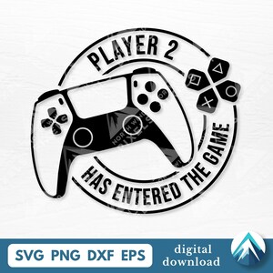 May include: Black and white graphic of a video game controller with the text "PLAYER 2 HAS ENTERED THE GAME" in a circular design. Includes directional buttons and the digital download file types: SVG, PNG, DXF, and EPS.