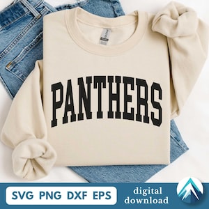 May include: A cream-colored sweatshirt with the word "PANTHERS" in bold, black, arched lettering. The sweatshirt is folded on top of a pair of blue jeans. The bottom of the image includes the text "SVG PNG DXF EPS" and "digital download".