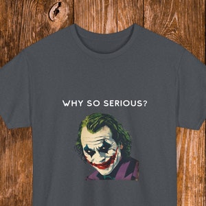 May include: Dark gray t-shirt with a white graphic of the Joker from the movie "The Dark Knight". The graphic includes the Joker's face and the text "WHY SO SERIOUS?"