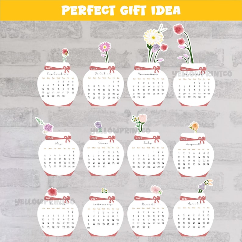 May include: A 2027 wall calendar featuring twelve white jar-shaped monthly pages, each decorated with a unique watercolor flower illustration at the top, a red ribbon graphic, and the text PERFECT GIFT IDEA at the top of the display.